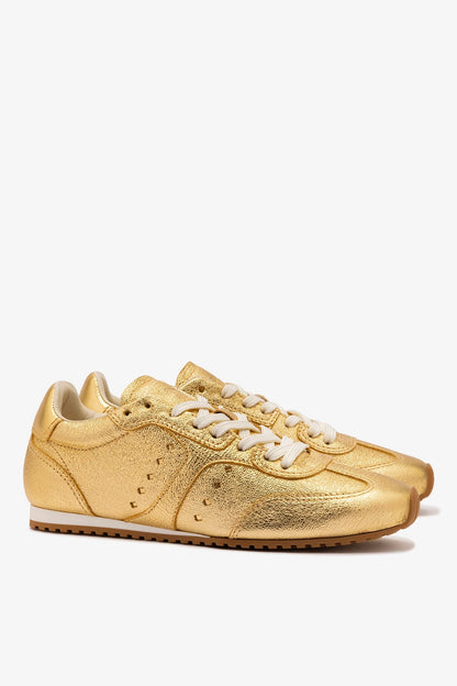 Stella Sneaker In Gold Metallic Leather - Larroude